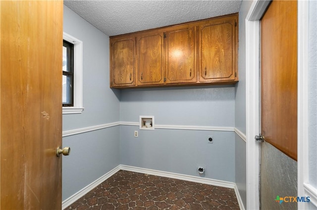 1606 Cedar Oaks Ln, Harker Heights, TX 76548 - washroom with electric dryer hookup, washer hookup, cabinet space, and a textured ceiling