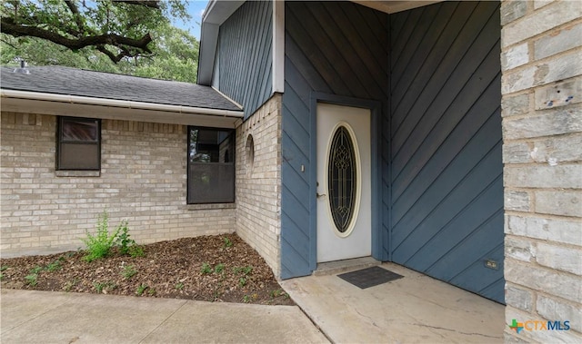 1606 Cedar Oaks Ln, Harker Heights, TX 76548 - doorway to property with brick siding and a shingled roof