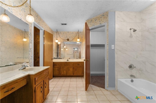 1606 Cedar Oaks Ln, Harker Heights, TX 76548 - bathroom featuring tile patterned floors, a textured ceiling, two vanities, and washtub / shower combination