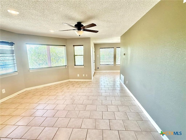 1795 Falconwood Dr, San Marcos, TX 78666 - empty room with ceiling fan and a textured ceiling