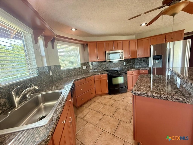 1795 Falconwood Dr, San Marcos, TX 78666 - kitchen with stainless steel appliances, a textured ceiling, a ceiling fan, tasteful backsplash, and light tile patterned flooring
