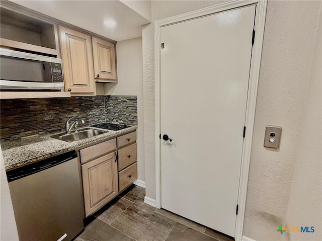 1795 Falconwood Dr, San Marcos, TX 78666 - kitchen featuring appliances with stainless steel finishes, decorative backsplash, and light brown cabinets