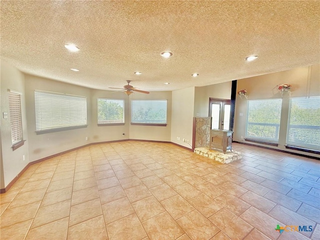 1795 Falconwood Dr, San Marcos, TX 78666 - unfurnished room with a ceiling fan, healthy amount of natural light, a textured ceiling, and recessed lighting