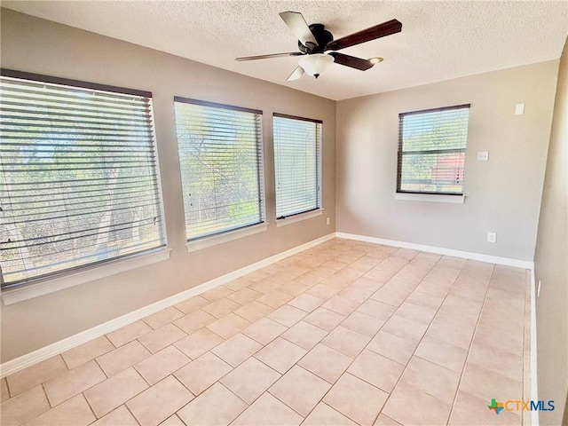 1795 Falconwood Dr, San Marcos, TX 78666 - empty room with a ceiling fan, a textured ceiling, and light tile patterned floors