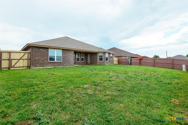 2102 Golden Eagle Dr, Killeen, TX 76549 - rear view of property with a fenced backyard and brick siding