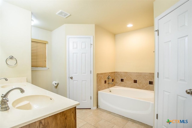 2102 Golden Eagle Dr, Killeen, TX 76549 - bathroom with a bath, double vanity, tile patterned flooring, and recessed lighting