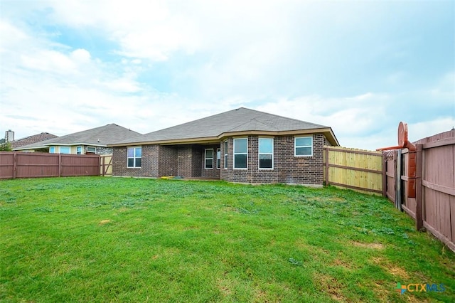 2102 Golden Eagle Dr, Killeen, TX 76549 - back of property featuring brick siding and a fenced backyard