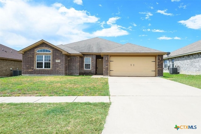 2102 Golden Eagle Dr, Killeen, TX 76549 - single story home with a garage, brick siding, a front lawn, and driveway