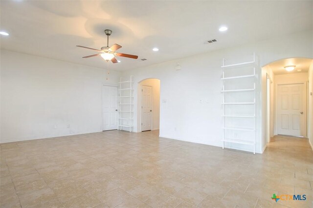 2102 Golden Eagle Dr, Killeen, TX 76549 - unfurnished room featuring arched walkways, ceiling fan, and recessed lighting