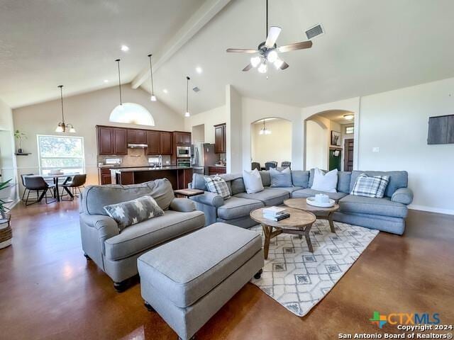 living room with visible vents, beam ceiling, high vaulted ceiling, finished concrete floors, and ceiling fan