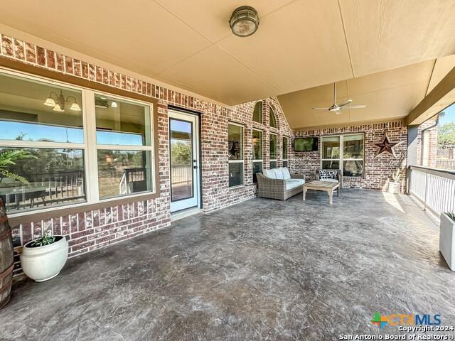 view of patio featuring a ceiling fan