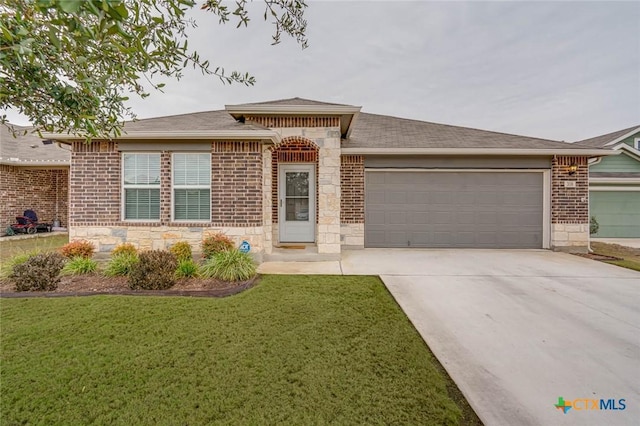 ranch-style home featuring a garage and a front yard