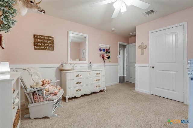 bedroom featuring light colored carpet and ceiling fan