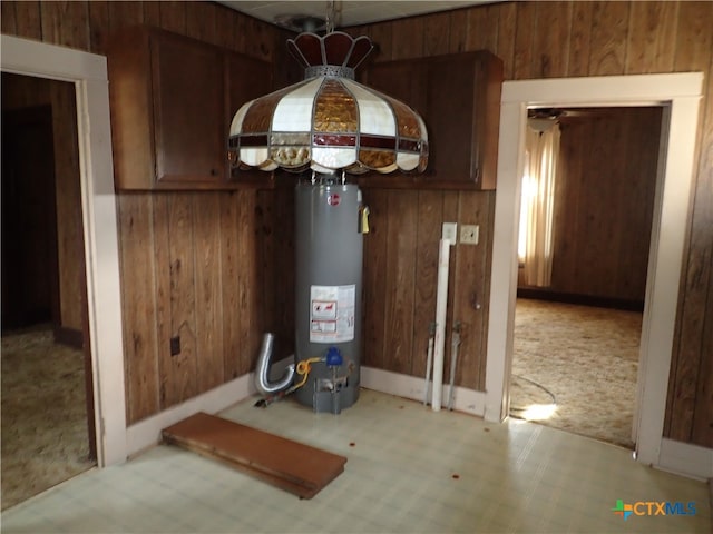 utility room with gas water heater