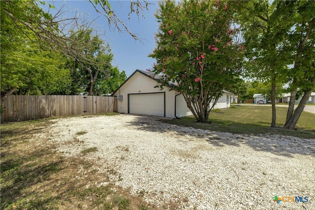 view of yard featuring a garage