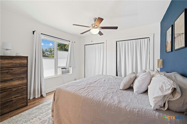 bedroom featuring a closet, cooling unit, ceiling fan, and light hardwood / wood-style flooring