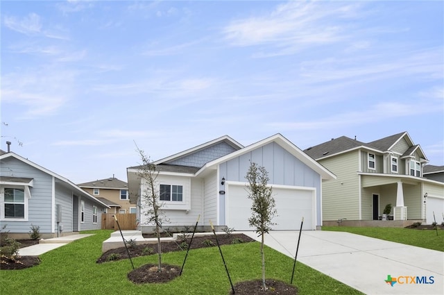 view of front facade with a garage and a front lawn