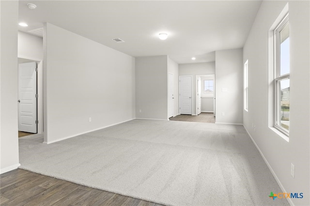 empty room featuring hardwood / wood-style flooring