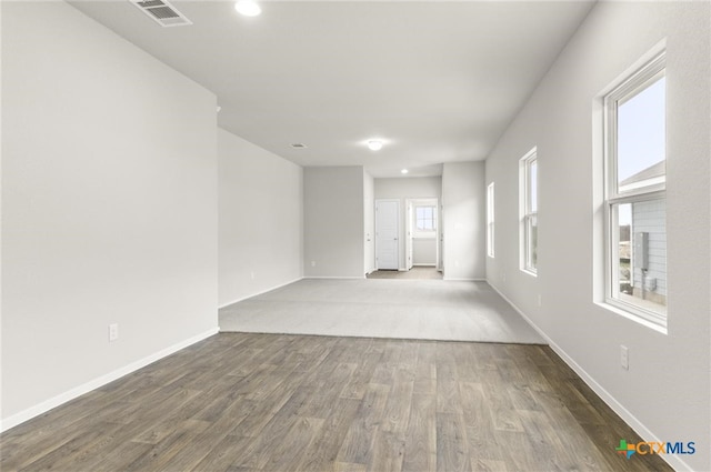 empty room featuring wood-type flooring