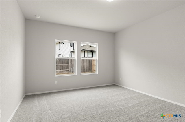 unfurnished room with carpet floors