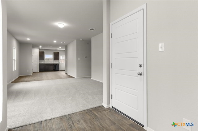 unfurnished living room with wood-type flooring