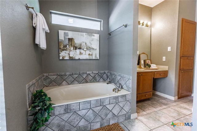 full bath featuring a bath, tile patterned flooring, and vanity