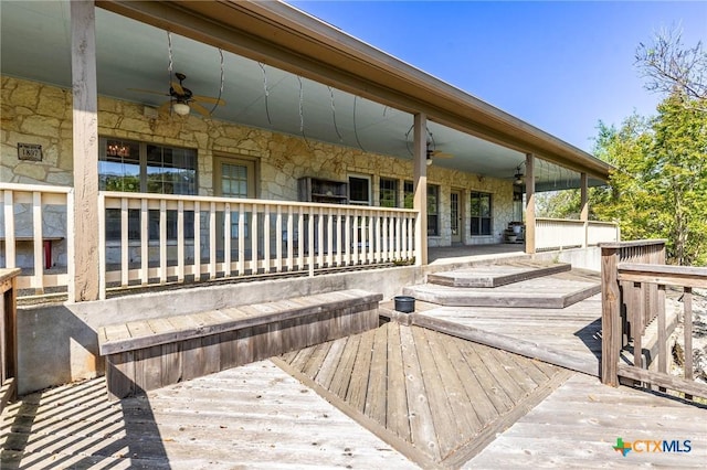 wooden terrace with a ceiling fan