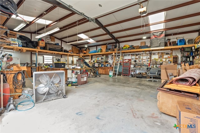 garage featuring a workshop area and a garage door opener