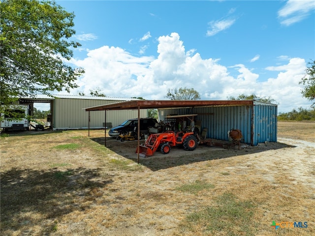 view of parking / parking lot with a carport