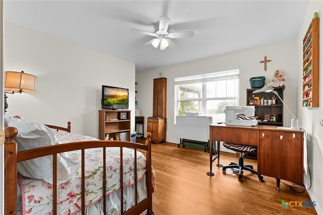 bedroom featuring hardwood / wood-style floors and ceiling fan