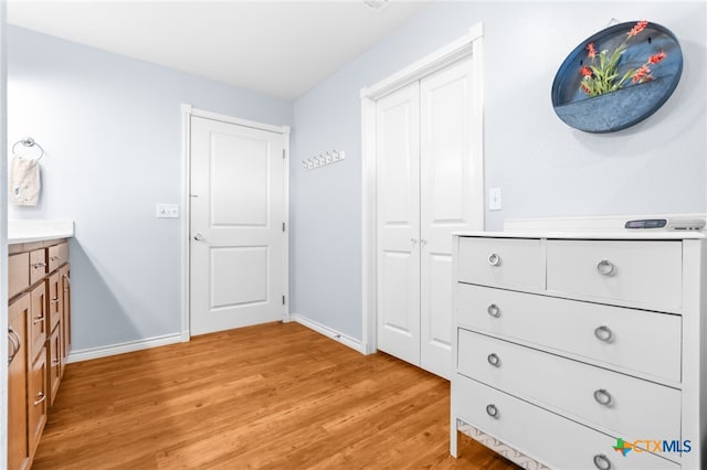 hallway with light hardwood / wood-style flooring