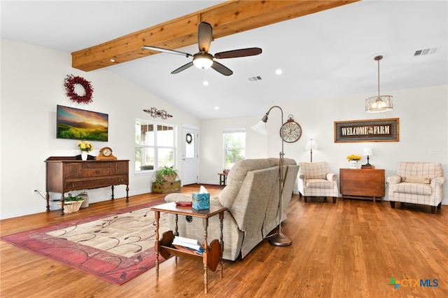 living room featuring wood-type flooring, vaulted ceiling with beams, and ceiling fan