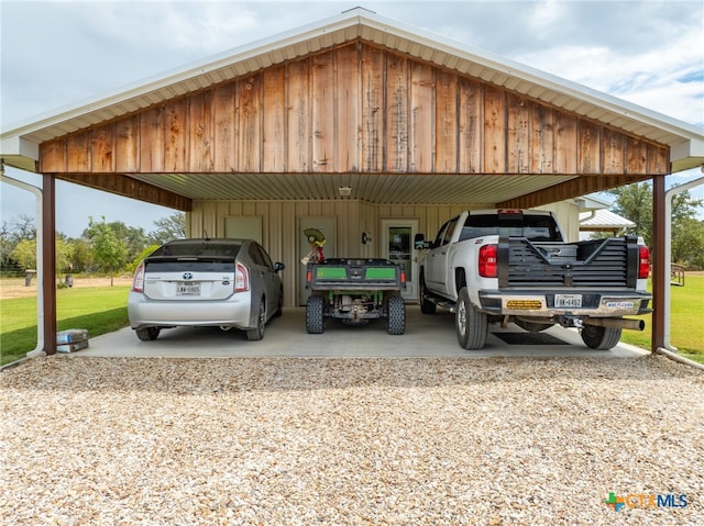 view of car parking with a yard and a carport