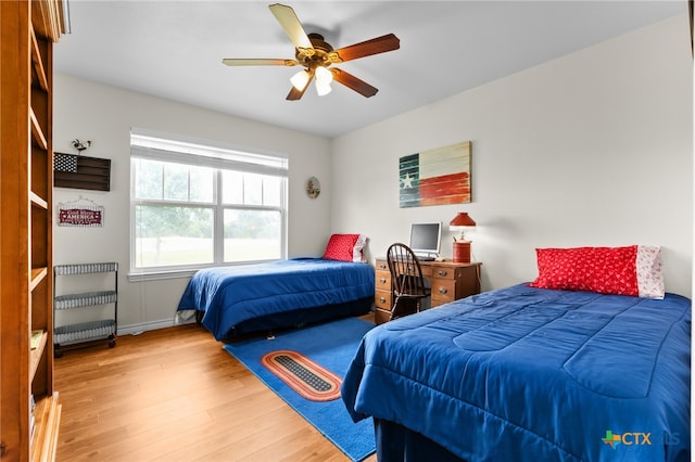 bedroom featuring wood-type flooring and ceiling fan