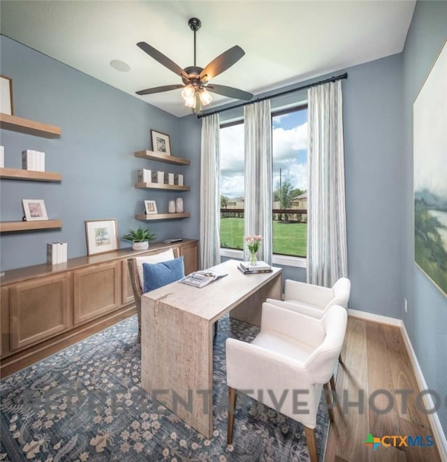 office area featuring wood-type flooring and ceiling fan