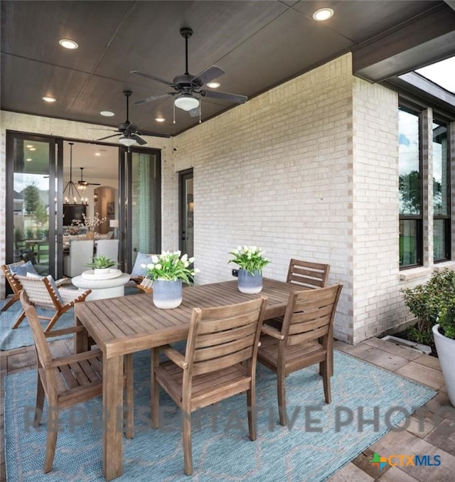 view of patio / terrace featuring ceiling fan