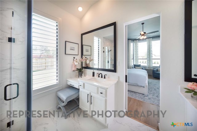 bathroom with lofted ceiling, vanity, and a shower with shower door