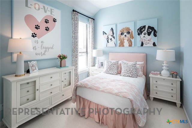 carpeted bedroom with multiple windows and vaulted ceiling