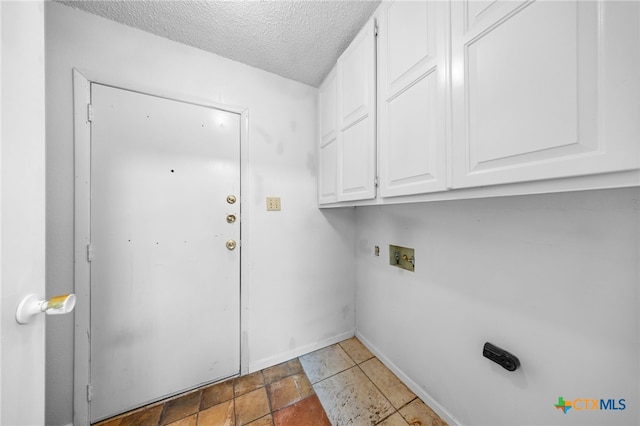 2310 Bunker Hill Dr, Temple, TX 76504 - laundry area featuring cabinet space, a textured ceiling, and washer hookup