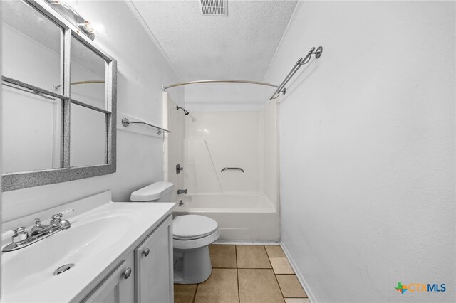 2310 Bunker Hill Dr, Temple, TX 76504 - bathroom with a textured ceiling, vanity, tile patterned flooring, and shower / bathtub combination