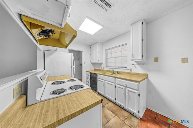 2310 Bunker Hill Dr, Temple, TX 76504 - kitchen featuring white appliances, white cabinetry, and a textured ceiling