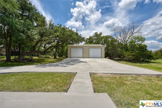 garage featuring a yard