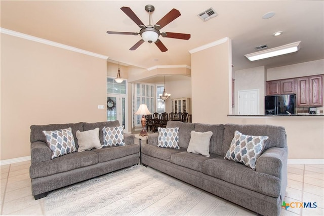 living area with light tile patterned flooring, visible vents, and crown molding