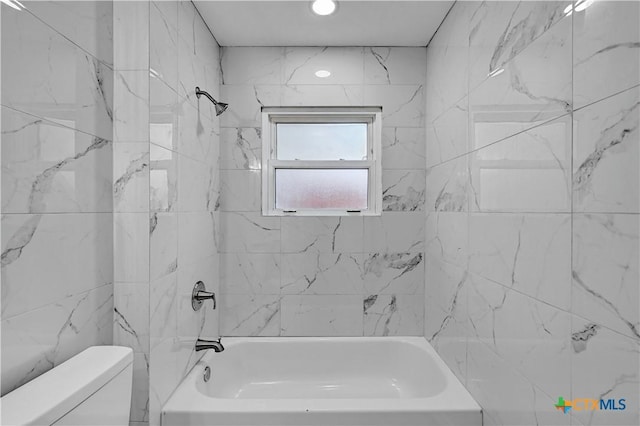 bathroom featuring toilet and shower / bathing tub combination