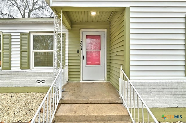 entrance to property with brick siding