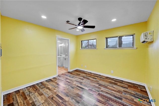 empty room with a ceiling fan, baseboards, wood finished floors, and recessed lighting