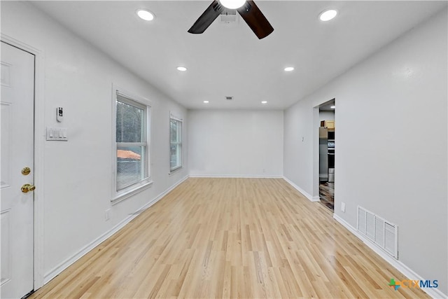 unfurnished living room with ceiling fan, recessed lighting, visible vents, baseboards, and light wood-style floors