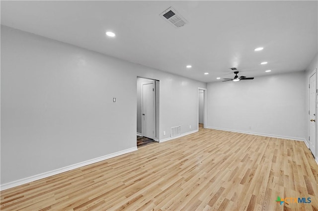 interior space with light wood-style flooring, visible vents, baseboards, and recessed lighting