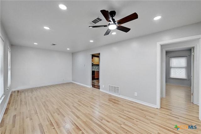 unfurnished living room with baseboards, recessed lighting, visible vents, and light wood-style floors