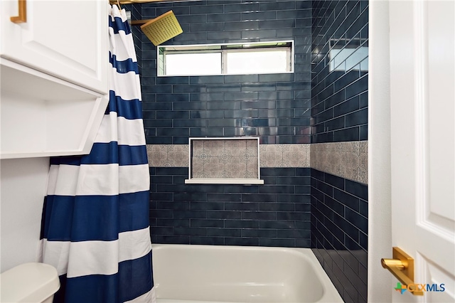 bathroom featuring toilet and shower / bathtub combination with curtain